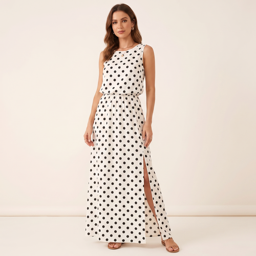 Woman wearing a white dress with black polka dots on a beige background