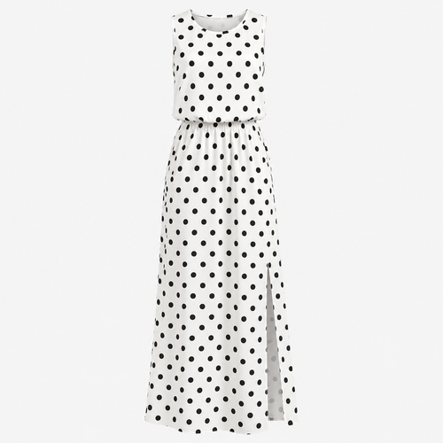 White dress with black polka dots on a white background