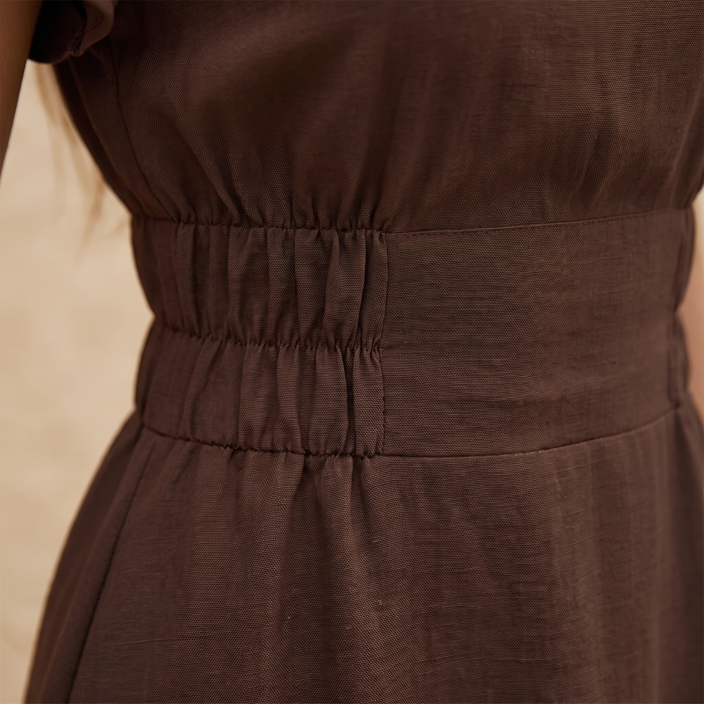 Brown dress with a focus on the waistband
