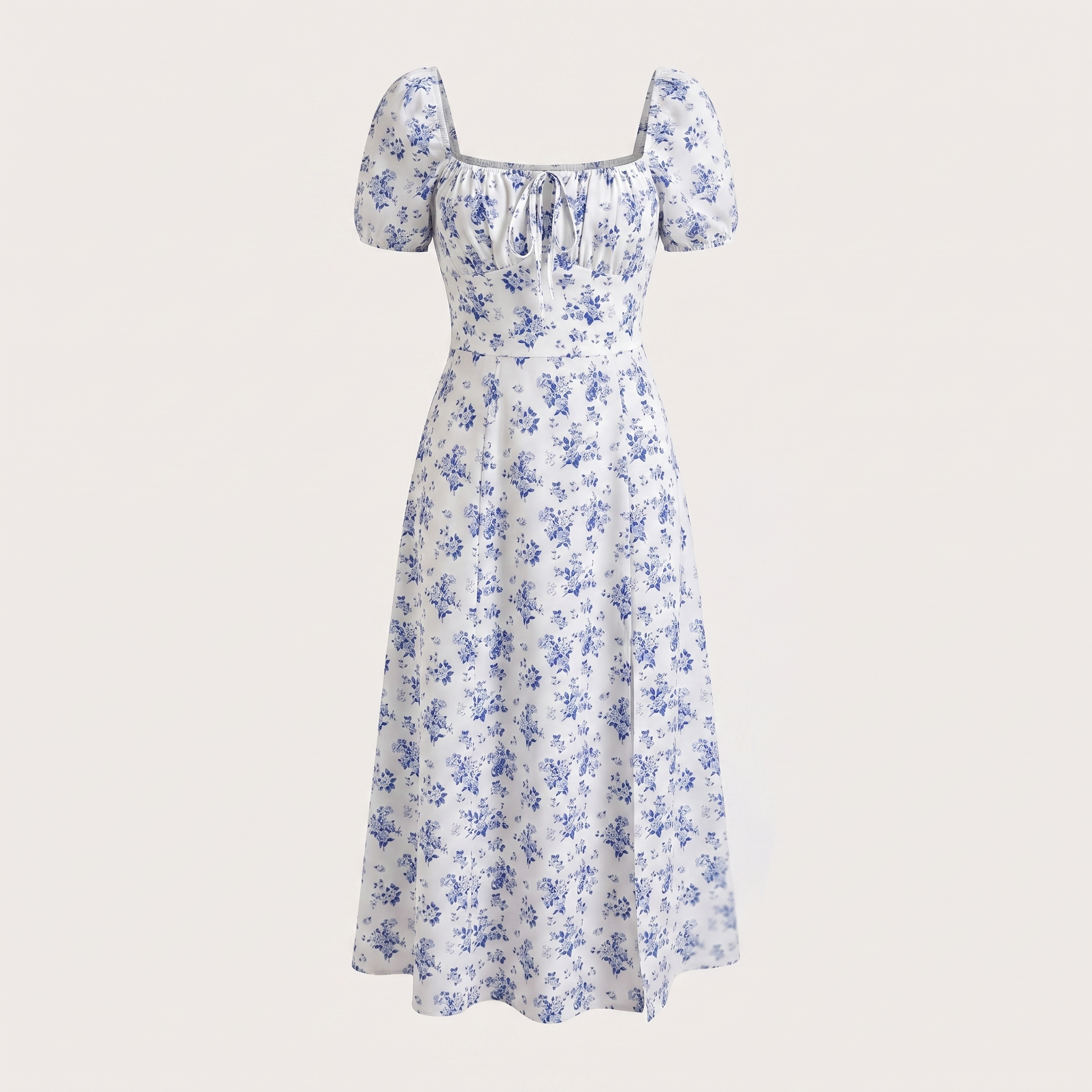 White dress with blue floral pattern on a light gray background