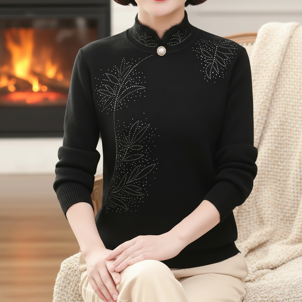 Black fitted sweater with a high mandarin collar, single pearl button, and delicate rhinestone leaf accents.