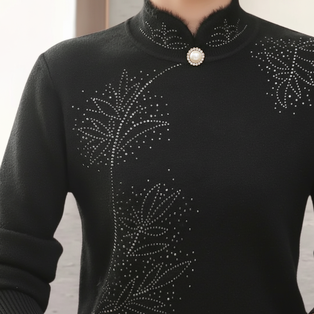 Black fitted sweater with a high mandarin collar, single pearl-style button, and delicate rhinestone leaf accents.