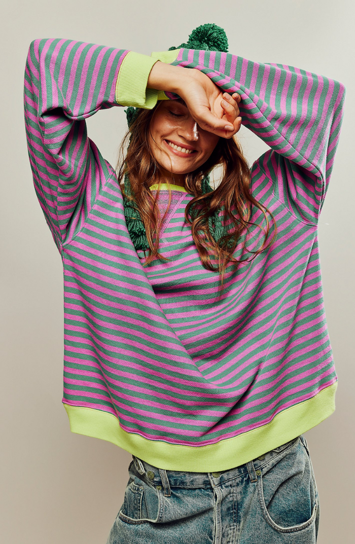 Oversized pink and green striped sweatshirt with balloon sleeves and ribbed lime trim.
