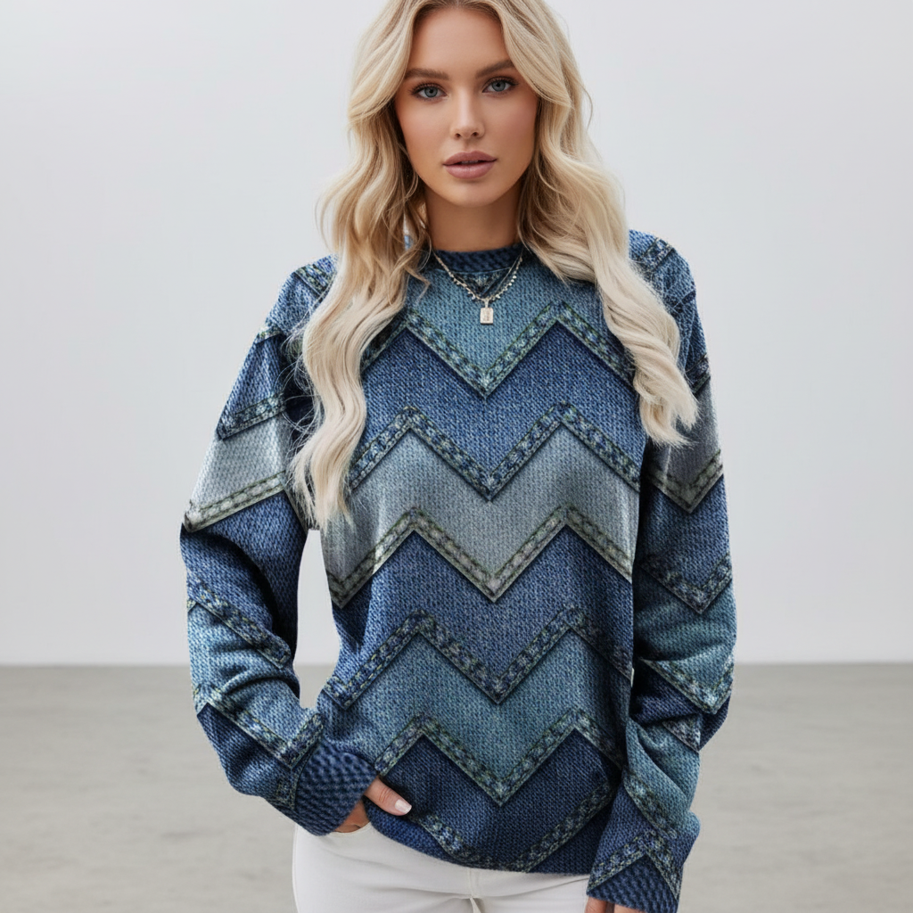 Relaxed blue crew neck knit sweater featuring a chevron print pattern, long sleeves, and ribbed cuffs.