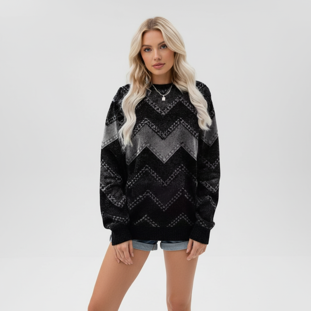 Relaxed-fit black knit sweater with a grey chevron print, crew neckline, and long sleeves with ribbed cuffs.