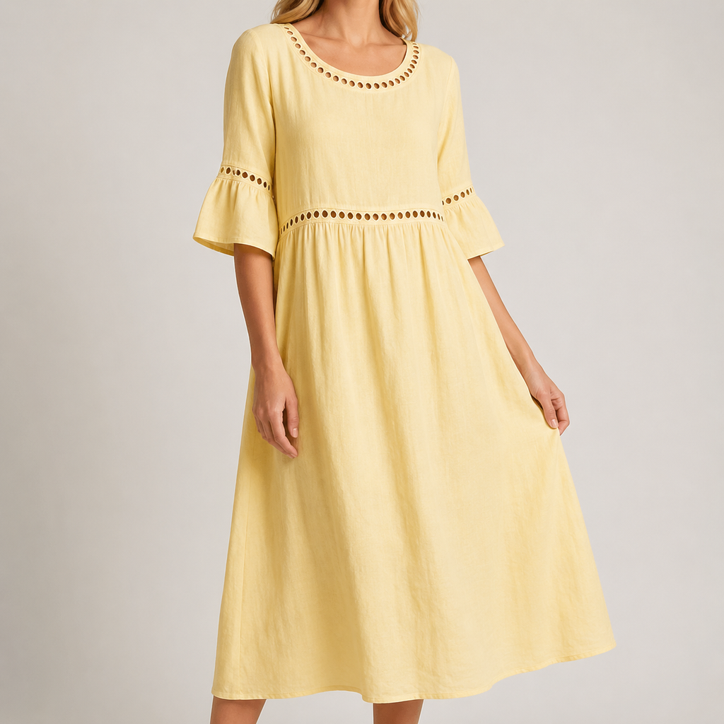 A woman wearing a pastel yellow linen-look midi dress with eyelet trim, flared sleeves and a gathered waist in a neutral studio setting.