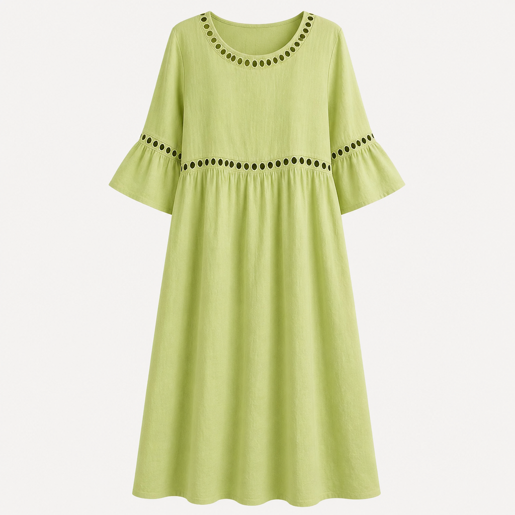 A light lime green midi dress with three-quarter bell sleeves, featuring decorative black embroidered dots around the round neckline and waistline, shown against a plain light gray background.