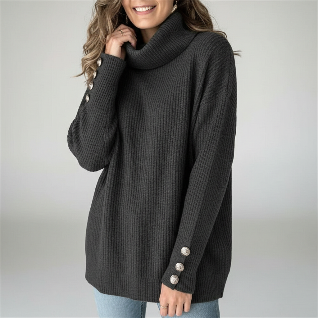 Dark grey ribbed cowl neck sweater with long sleeves and decorative silver buttons on the cuffs.