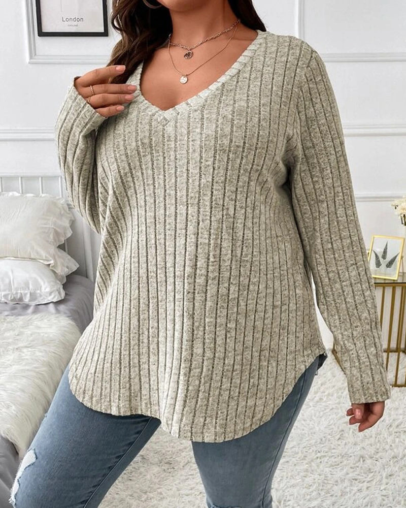 Women’s beige ribbed V-neck jumper in a soft cotton blend with long sleeves and a relaxed, comfortable fit.