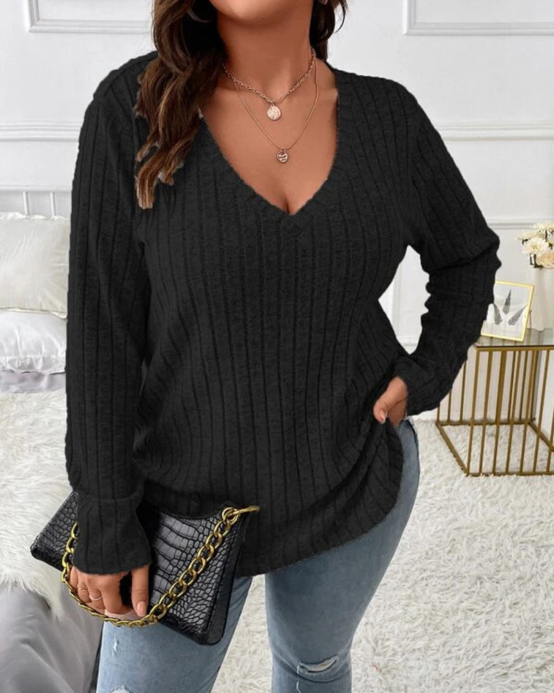 Women’s black long-sleeve V-neck jumper in a soft ribbed cotton blend with a relaxed, comfortable fit.
