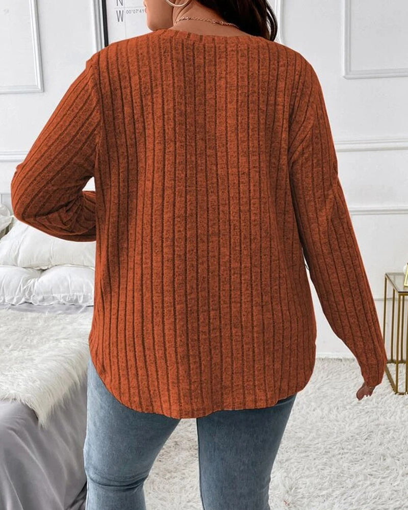 Back view of a rust-orange ribbed long-sleeve jumper in a soft cotton blend with a relaxed, casual fit.