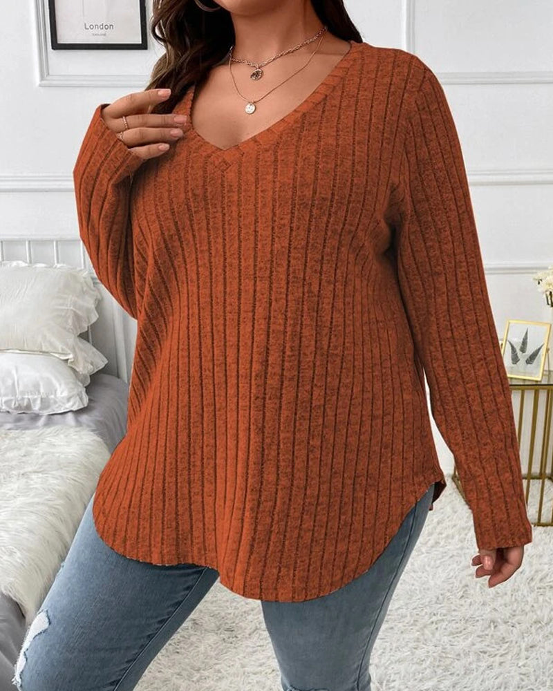Rust orange long-sleeve V-neck jumper in a soft ribbed cotton blend with a relaxed, comfortable fit.