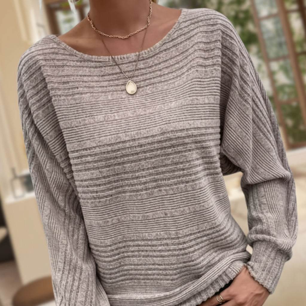 Taupe textured knit sweater with a wide round neckline and relaxed batwing sleeves featuring ribbed cuffs.