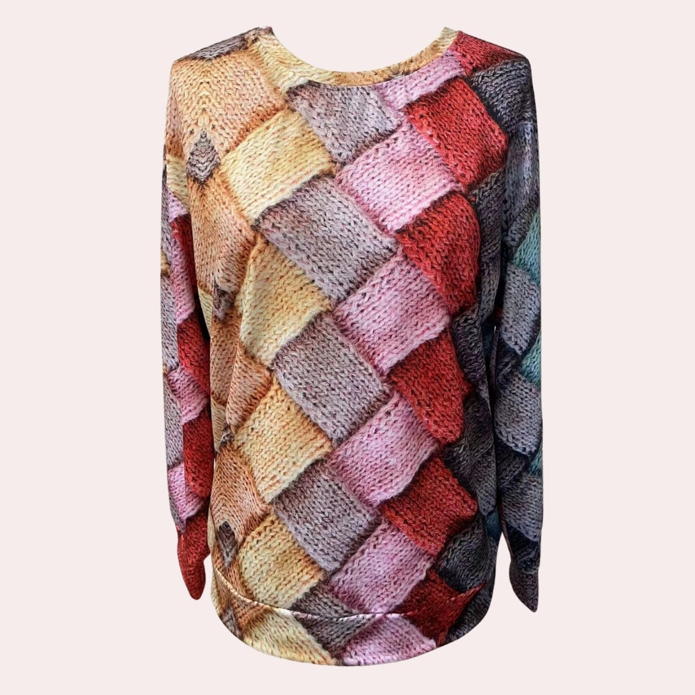 Relaxed raglan sweater featuring a multi-colored, textured basketweave knit pattern with a round neckline.