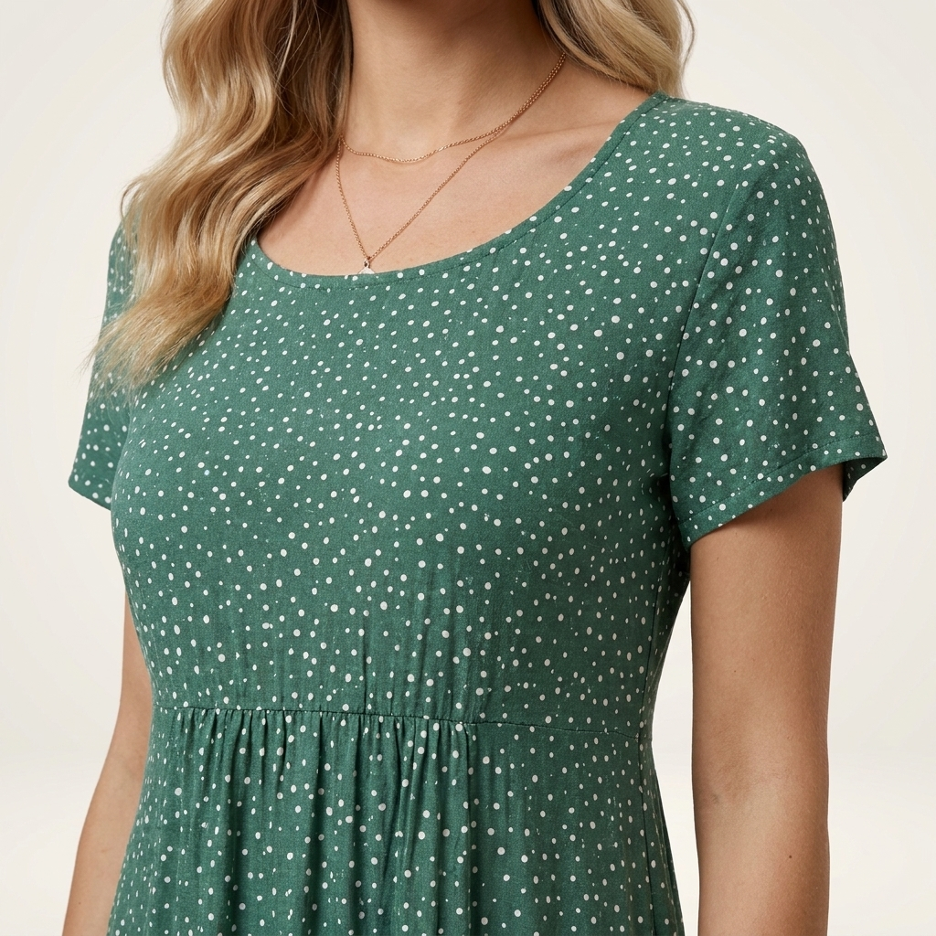 Close-up of the green dress neckline and fabric texture detail