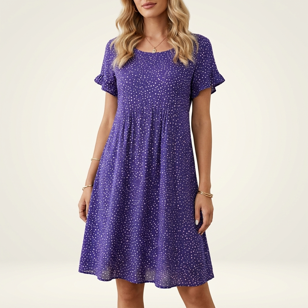 Woman wearing a blue boho flowing summer dress with a V-neck, front studio view