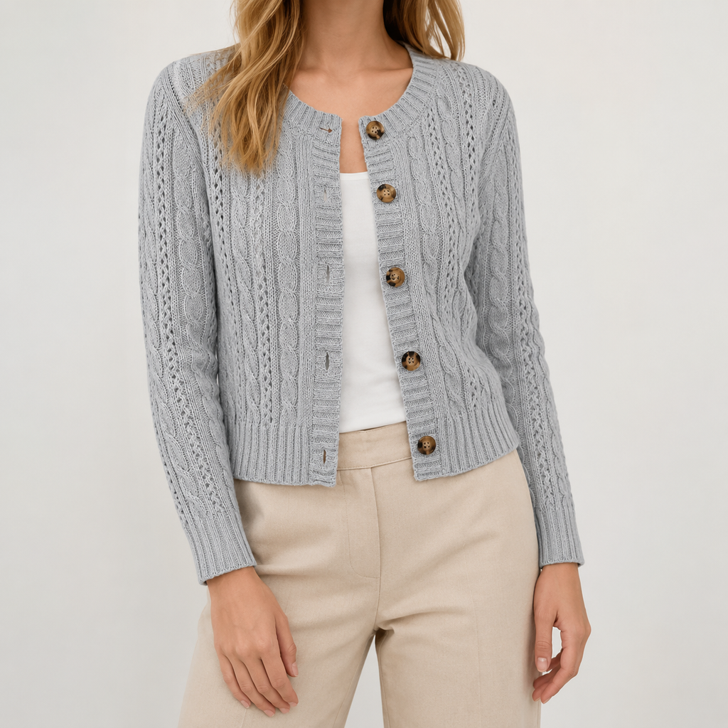Light blue cable knit cropped cardigan with a round neckline, button-through front, and ribbed trim.