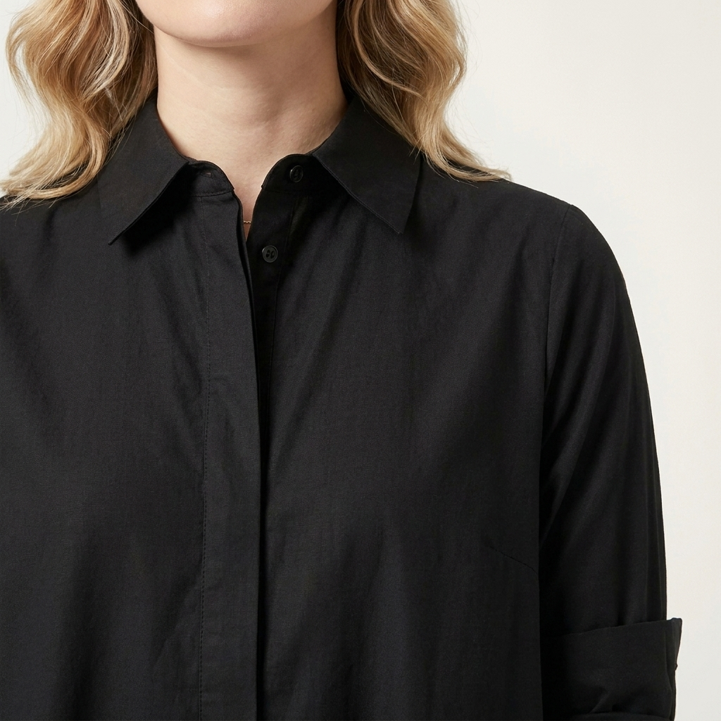 Close-up of the black dress collar and button placket detail