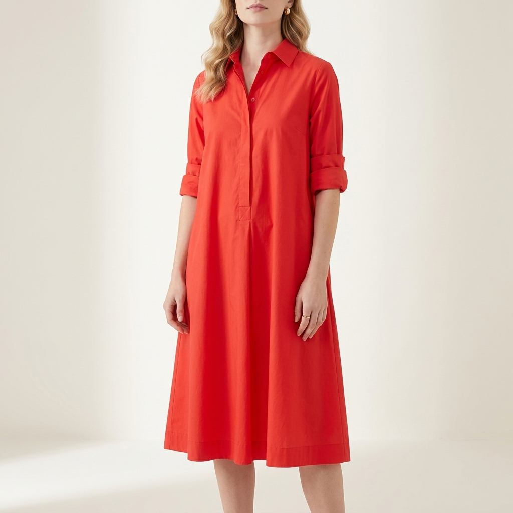Woman wearing a red collared shirt dress with a waist-height button placket, front studio view