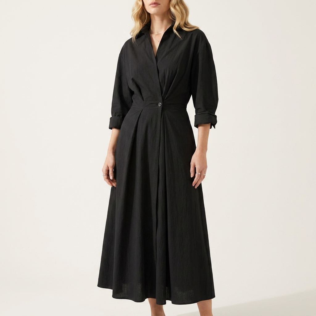 Woman wearing a black front wrap maxi dress with a collared neckline and single waist button, front studio view