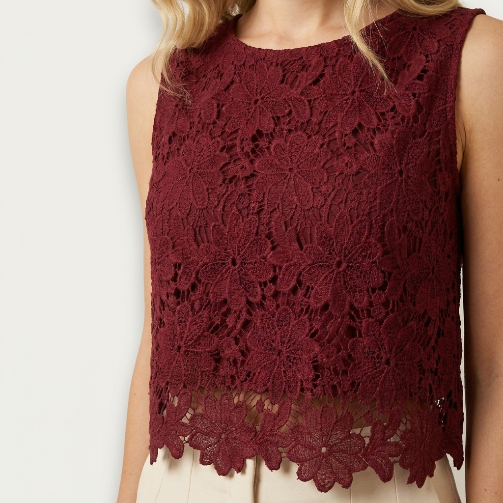 Close-up of the red top lace panel and scallop trim detail