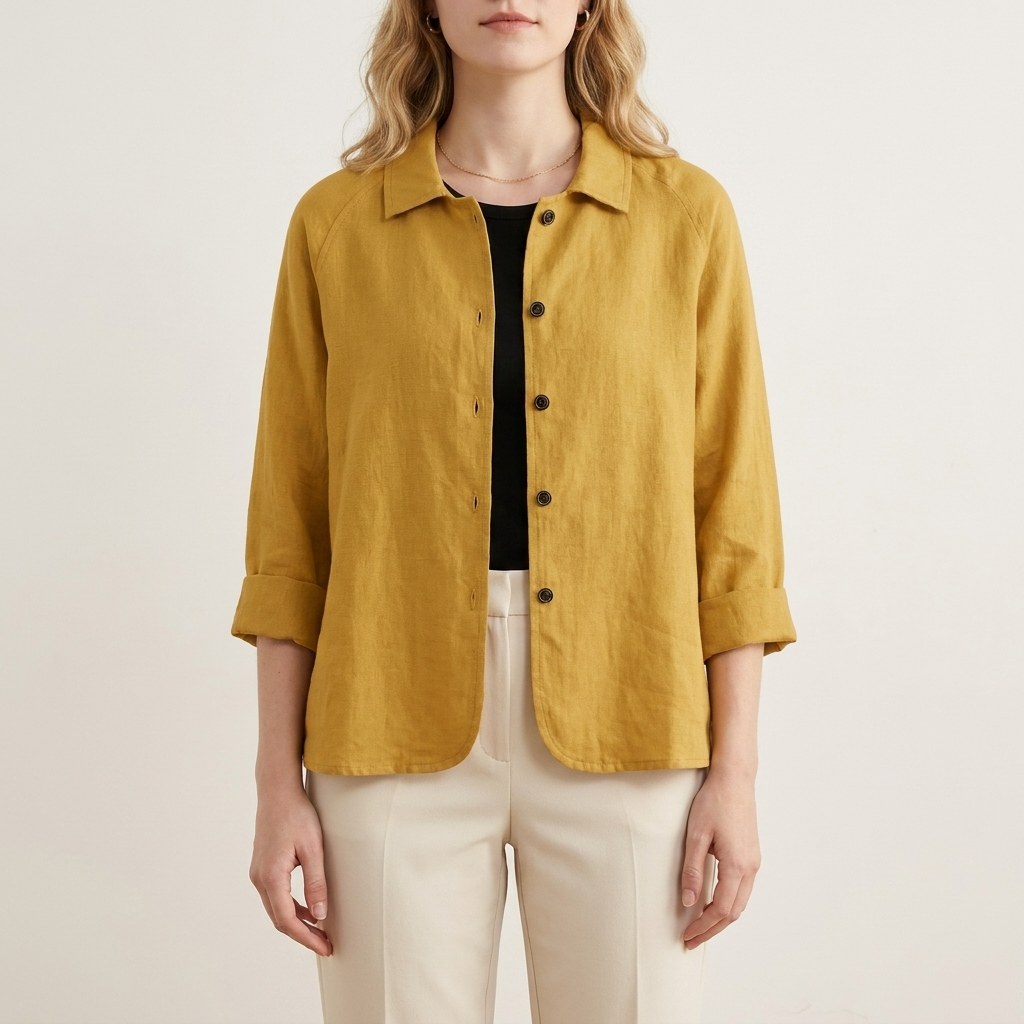 Woman wearing a yellow relaxed layering top, front studio view