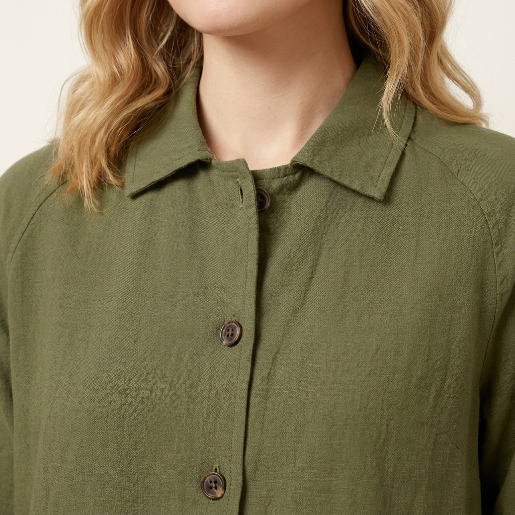Close-up of the olive green top neckline and fabric detail
