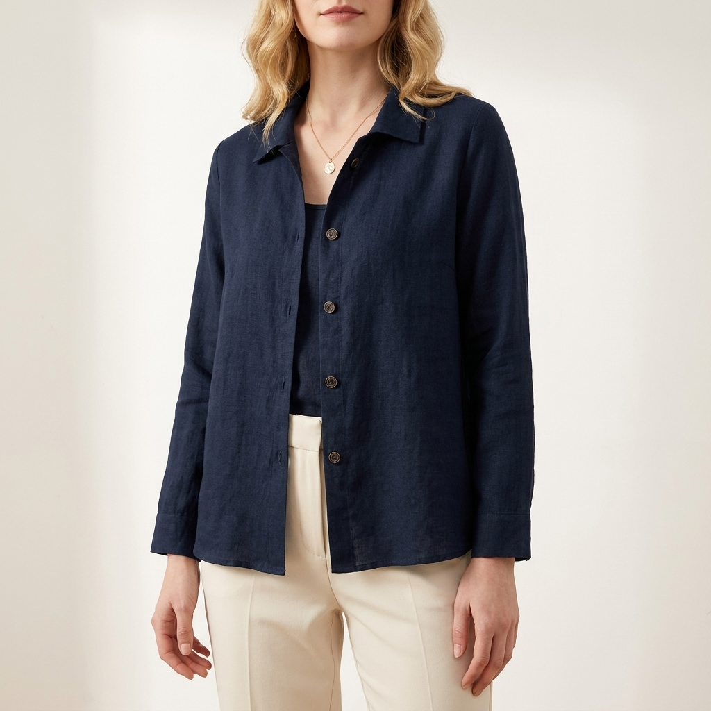 Woman wearing a dark blue relaxed layering top, front studio view
