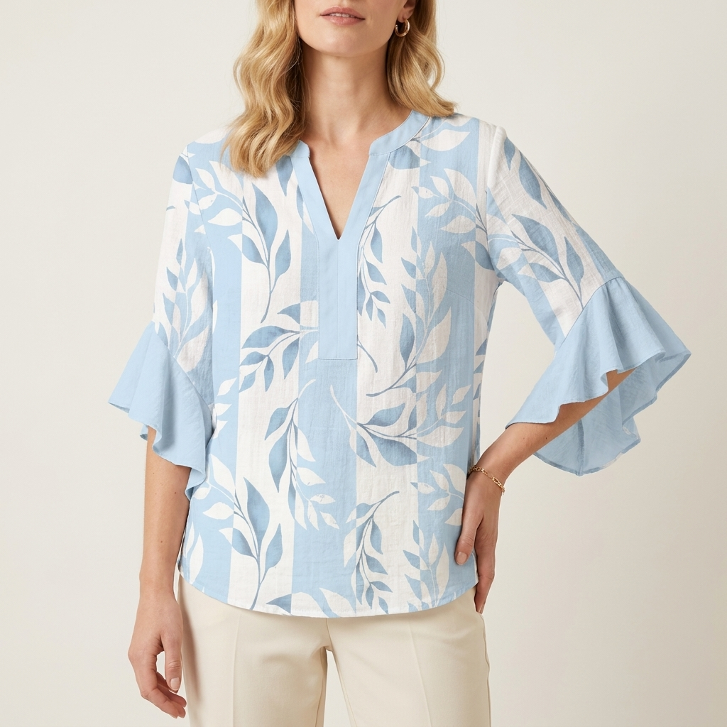 Woman wearing a light blue ruffle sleeve blouse with a plain V-neck, front studio view
