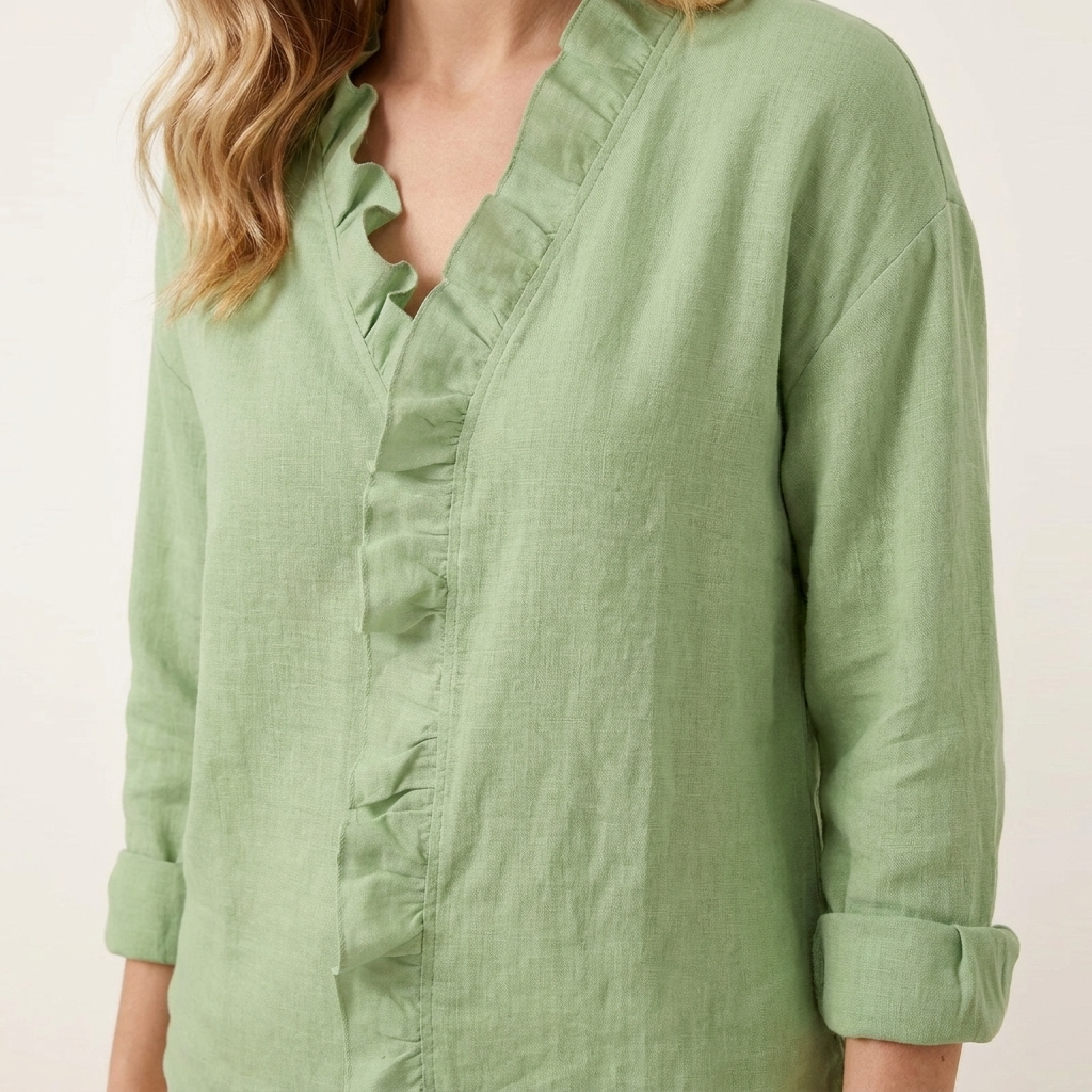 Close-up of the green blouse V-neckline ruffle detail