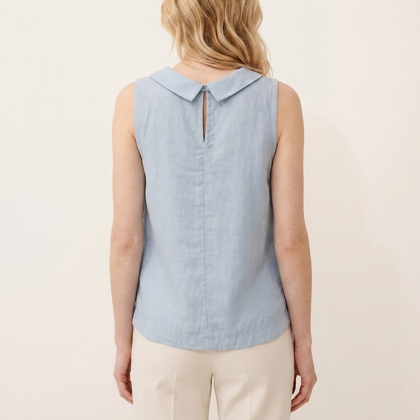 Back view of the blue sleeveless roll collar top