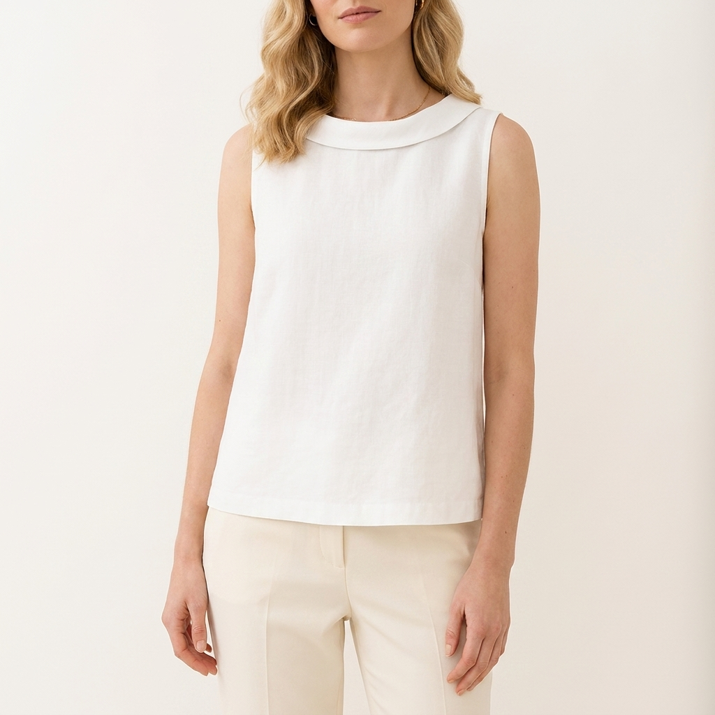 Woman wearing a white sleeveless roll collar top, front studio view