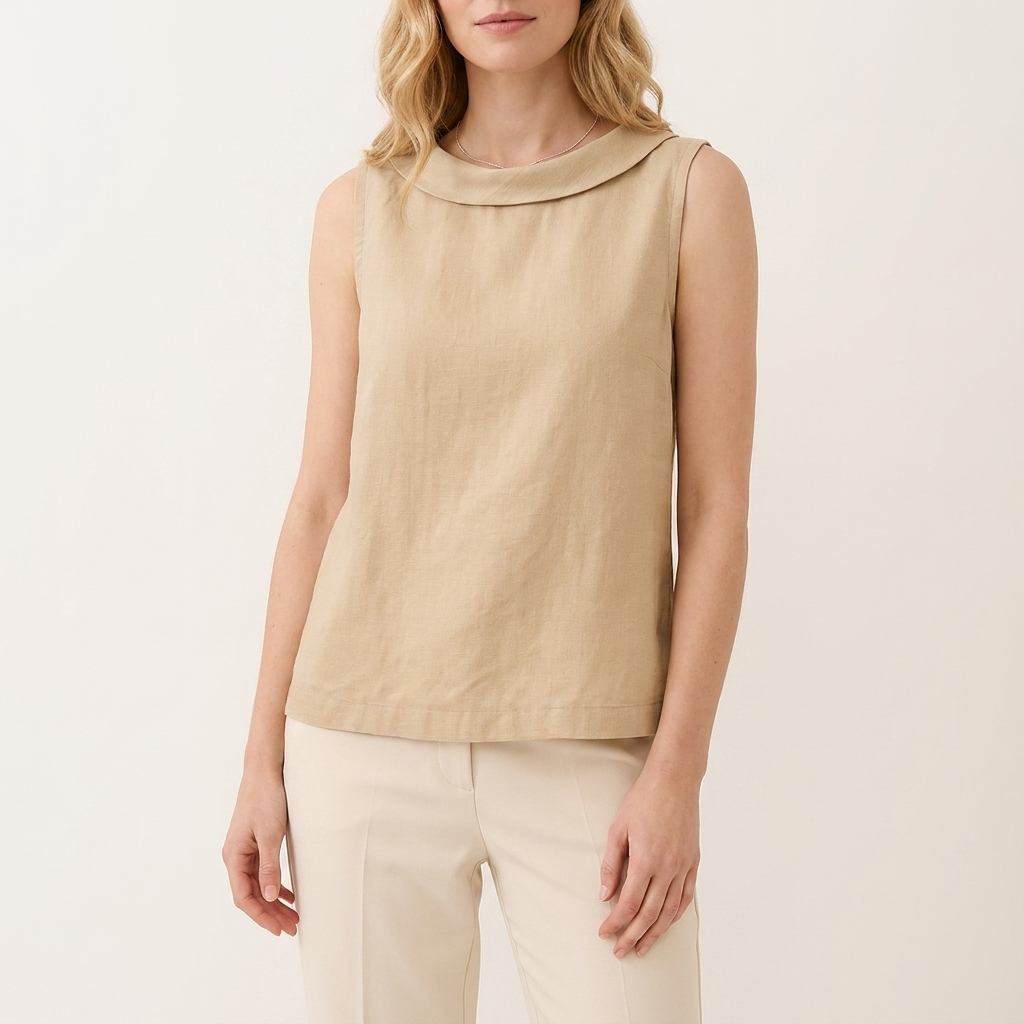 Woman wearing a beige sleeveless roll collar top, front studio view