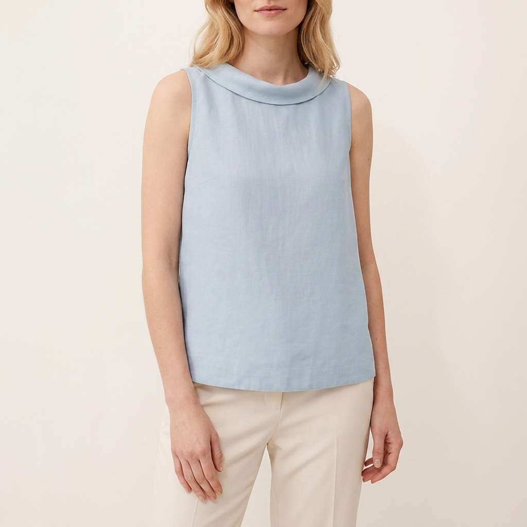 Woman wearing a blue sleeveless roll collar top, front studio view