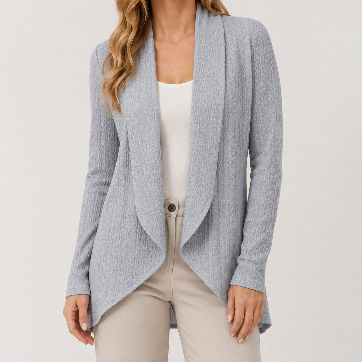Light blue textured waterfall cardigan with an open-front design and long sleeves worn over a white top.