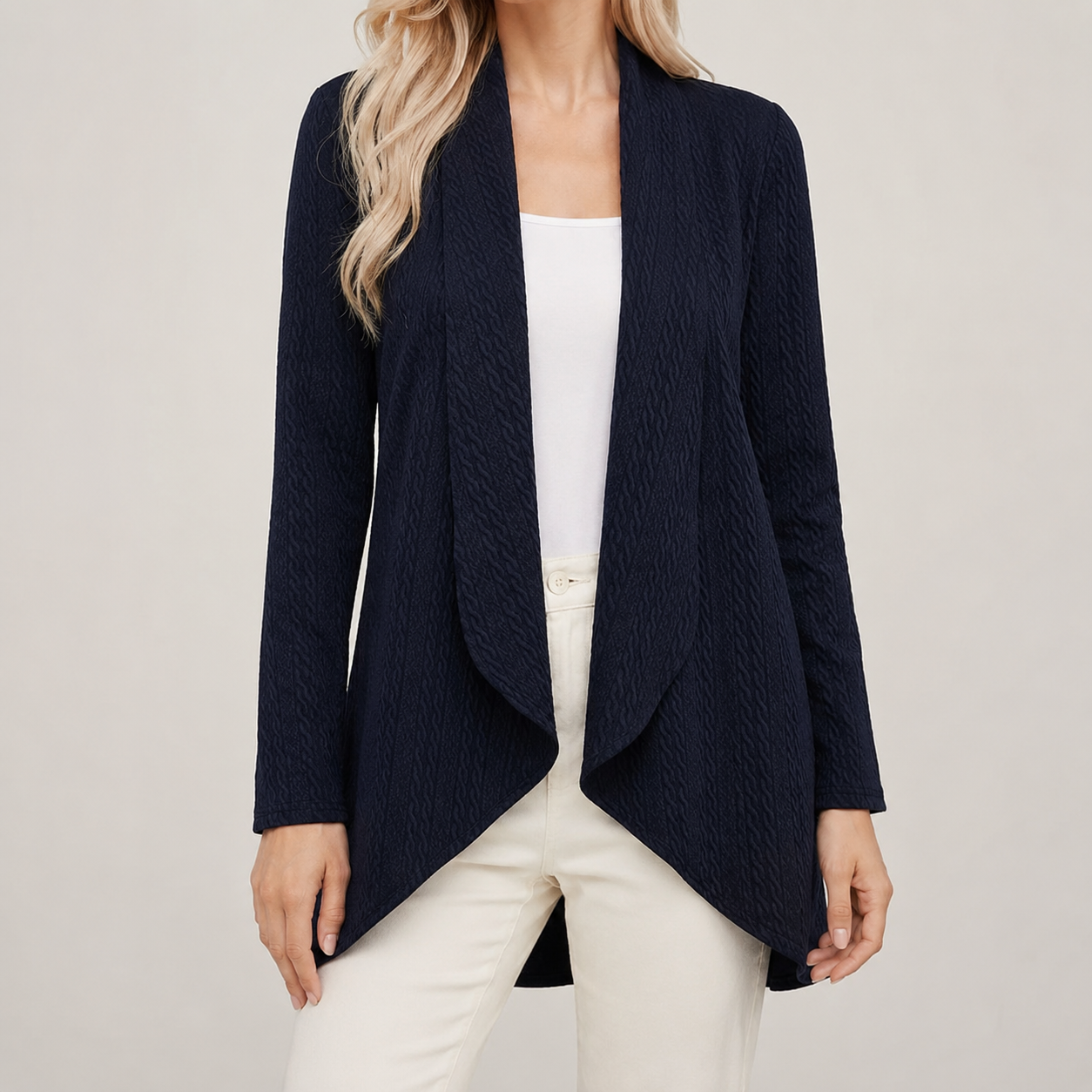 Navy blue open-front cardigan with a textured finish, waterfall drape, and long sleeves over a white top.