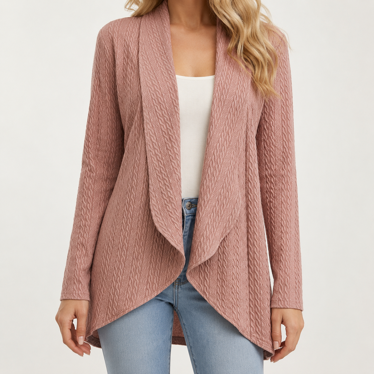 Dusty rose open-front cardigan with a textured finish, long sleeves, and a draped waterfall hem over jeans.